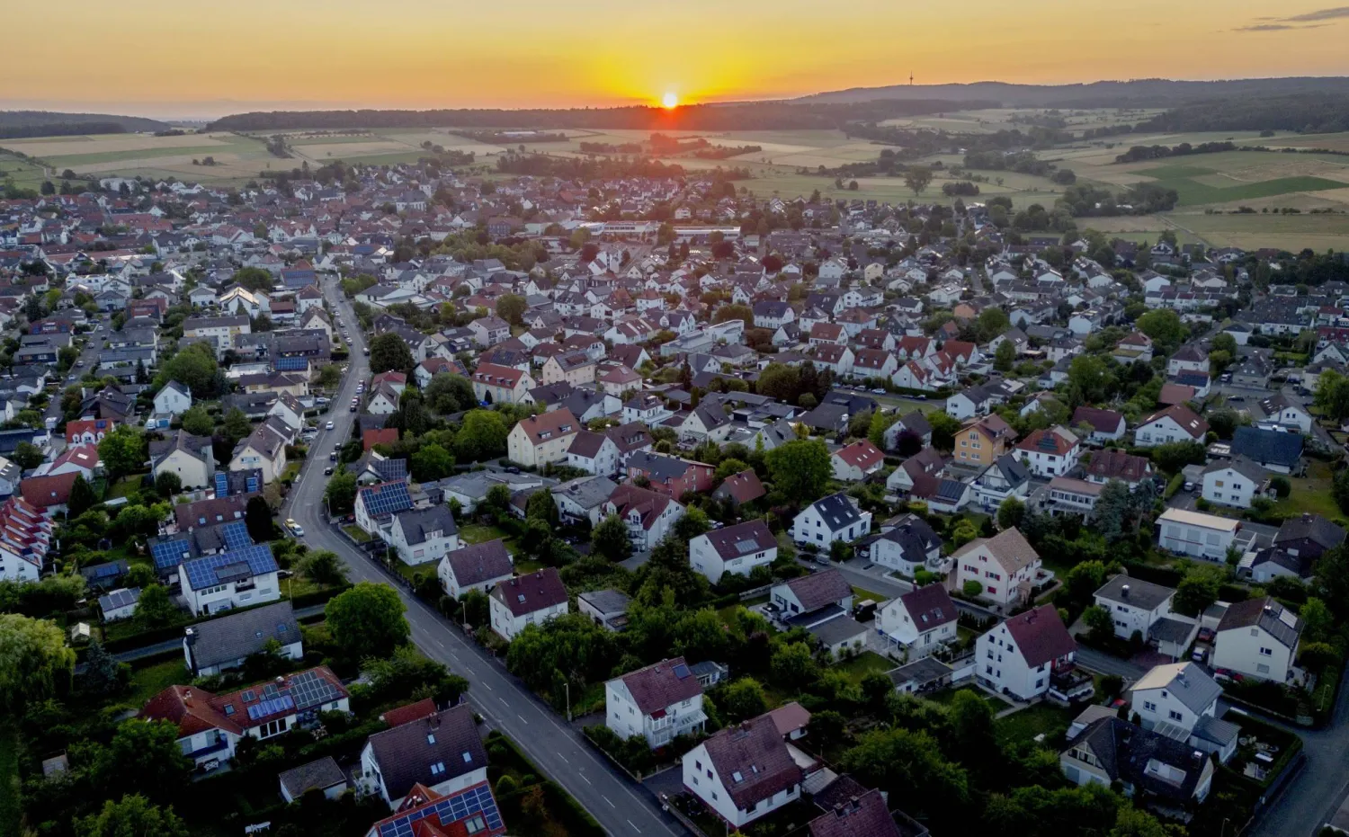 The sun rises over the city of Wehrheim near Frankfurt, Germany, Thursday, July 6, 2023. (AP Photo/Michael Probst)